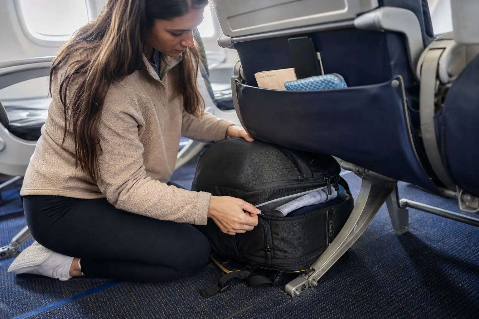 Real-life scene illustrating best personal-item backpacks for budget flights and one-bag weekends.
